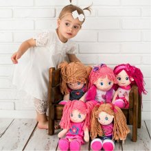 Smily Play Rag Doll in a pink dress with a...